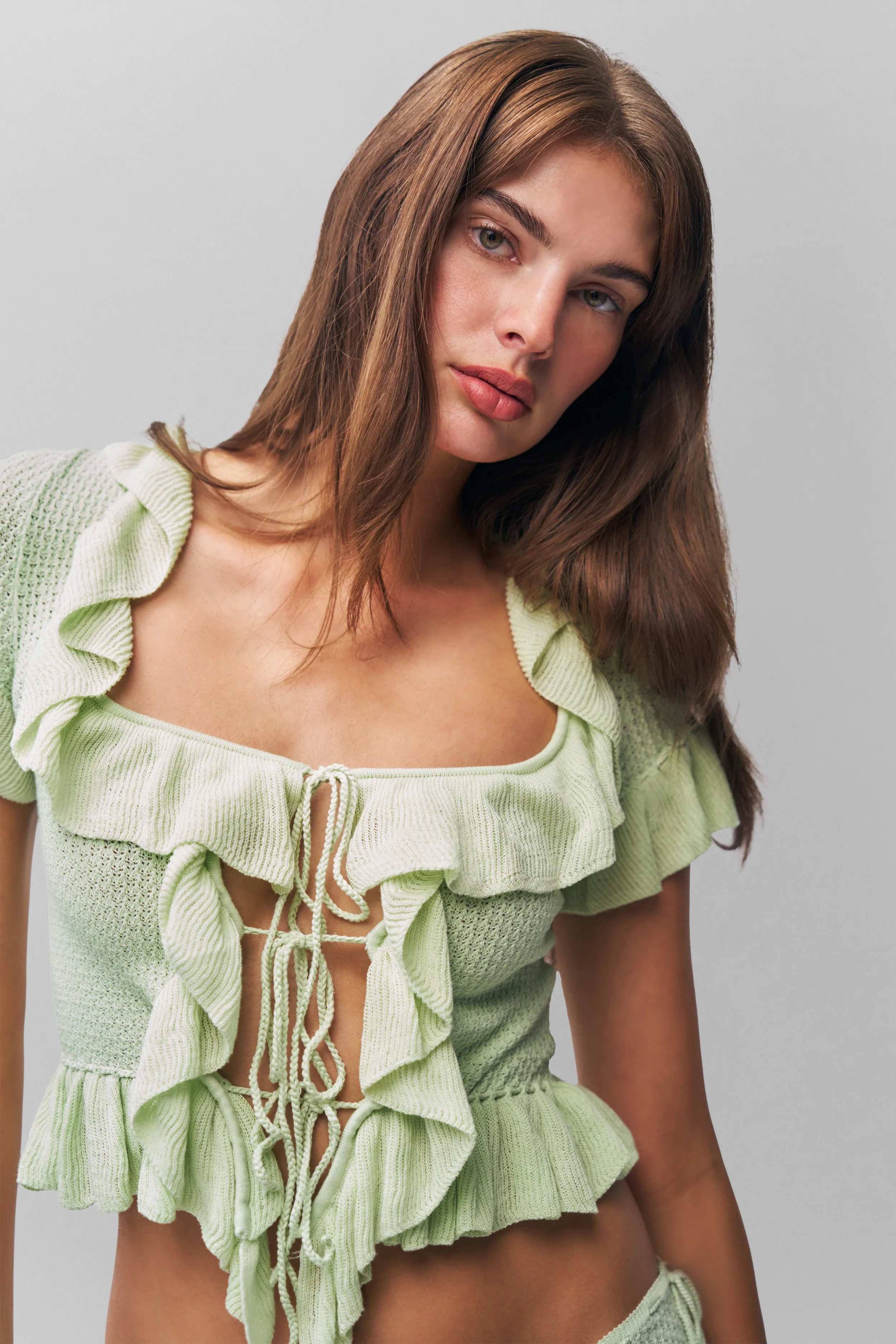 Flexible Material Enhanced Breathability Ruffle Knit Tie Top