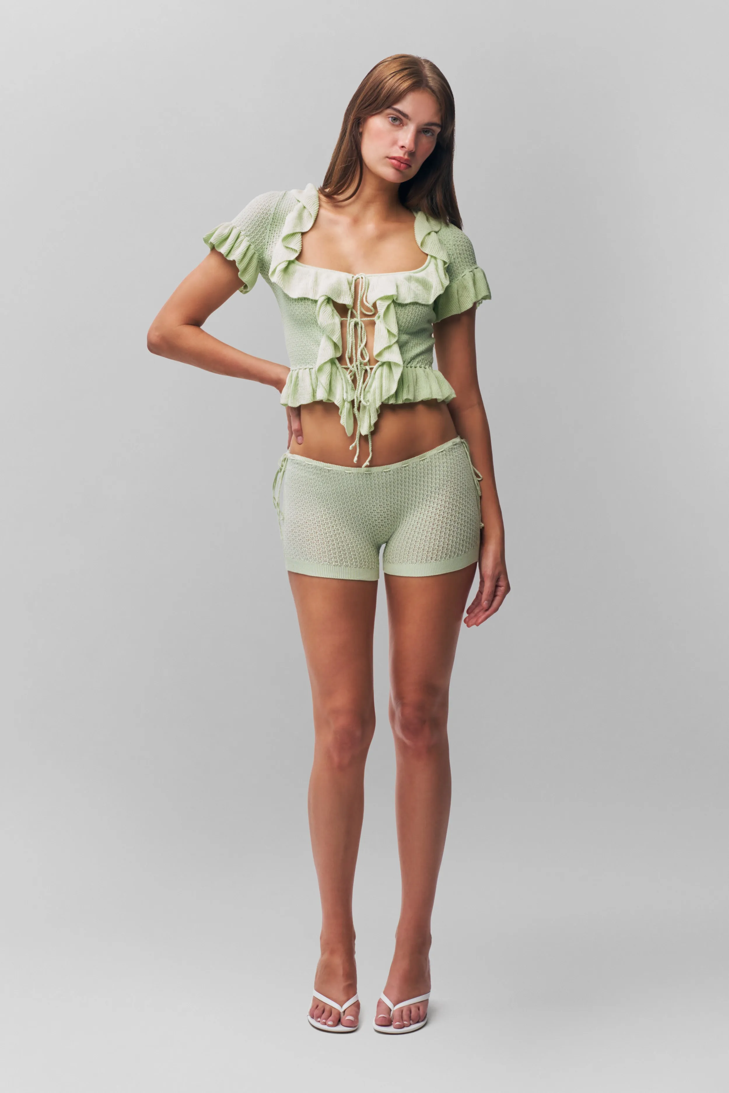 High Durability Fabric Multi Panel Construction Ruffle Knit Tie Top